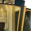 mirror with gilded gold finish and an art deco curved triptych shape.