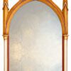 gilded gold frame and the gothic arched ogee shape on the mirror.