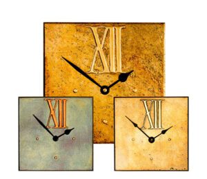 large square wall clock with large Roman dial withblack frame and white dial with black numbers and hands and large XII at the top