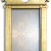 mirror with gilded gold frame and palladian shape.