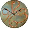 wooden case Clock with gilded marbled brown frame and round shape.