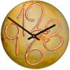 wooden case Clock with gilded rust frame and round shape.